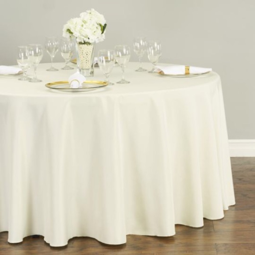 SOLD - 120” round ivory tablecloth